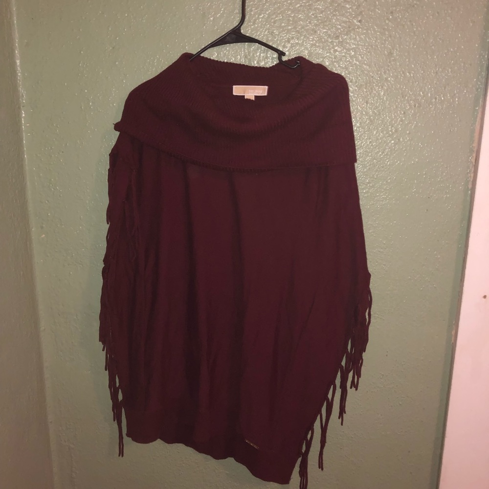 Sewn on side Michael Kors fringed shawl/cape.